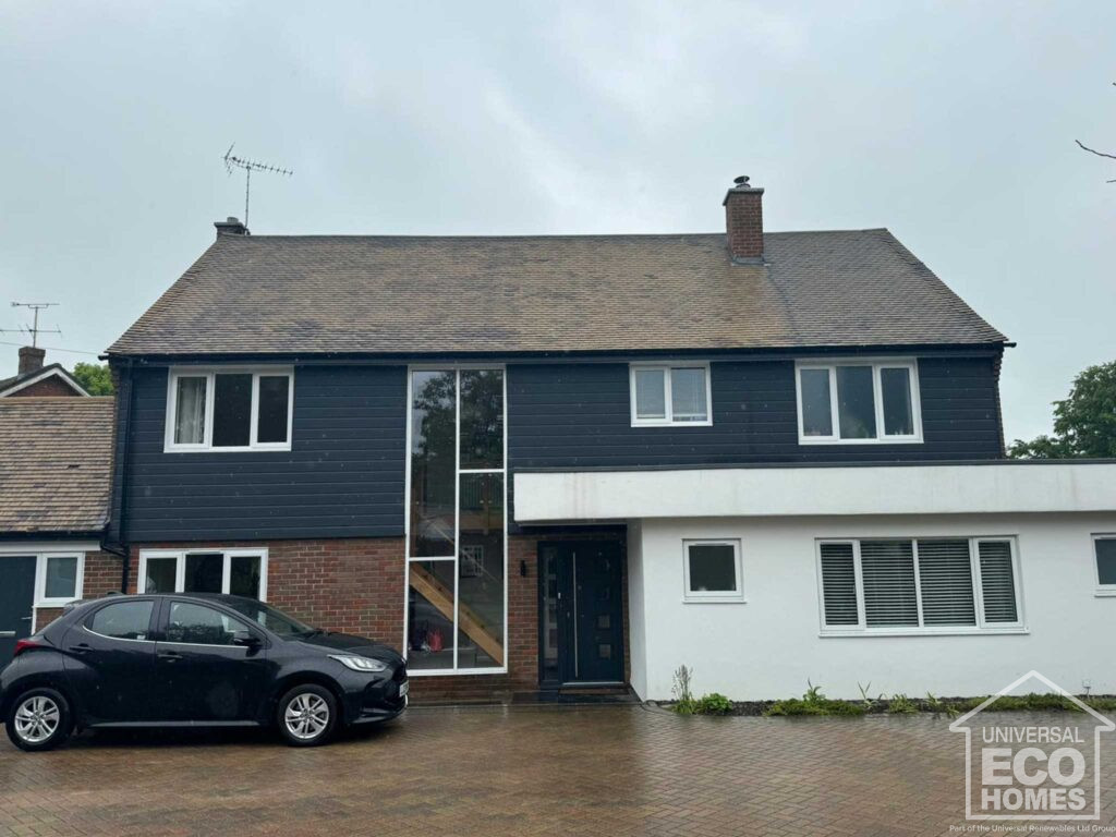 Exterior of large home before properla roof coating by Universal Eco Homes