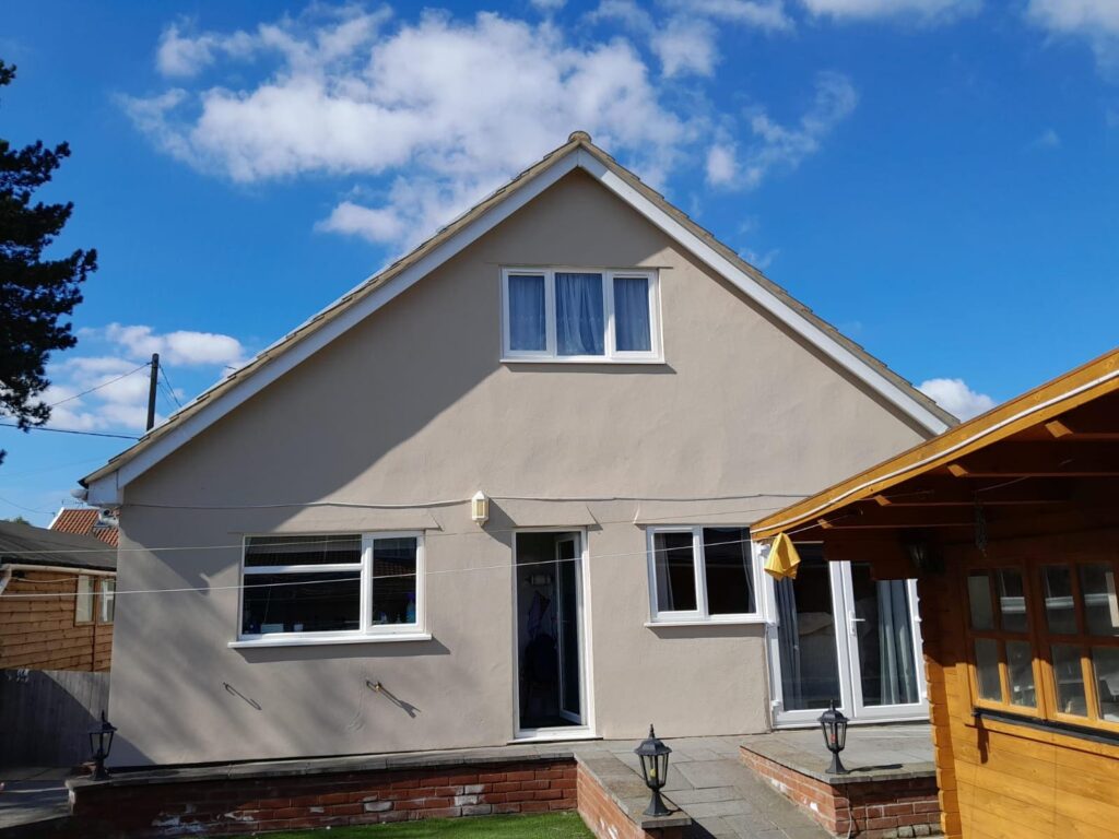 Close-up view of wall coating solutions creating a waterproof and breathable barrier on exterior walls