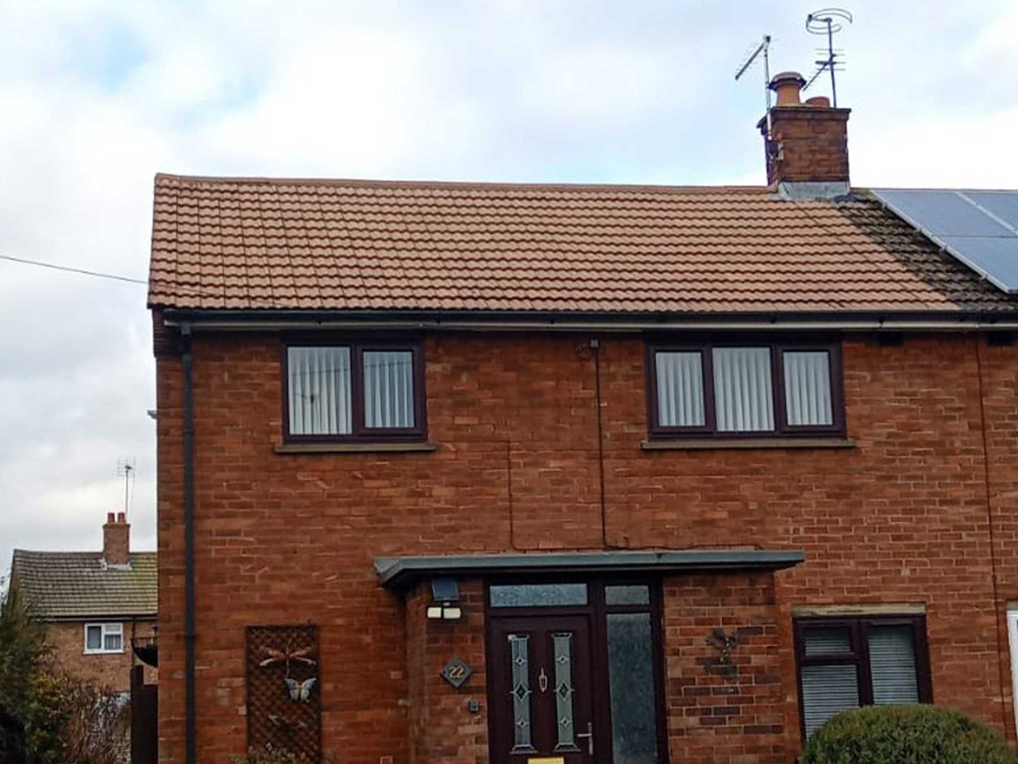 Exterior of front of brick semi detached house after moss removal and roof cleaning by Universal Eco Homes
