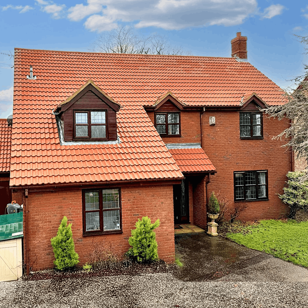 Exterior of beautiful detached home after moss removal and roof cleaningby Universal Eco Homes