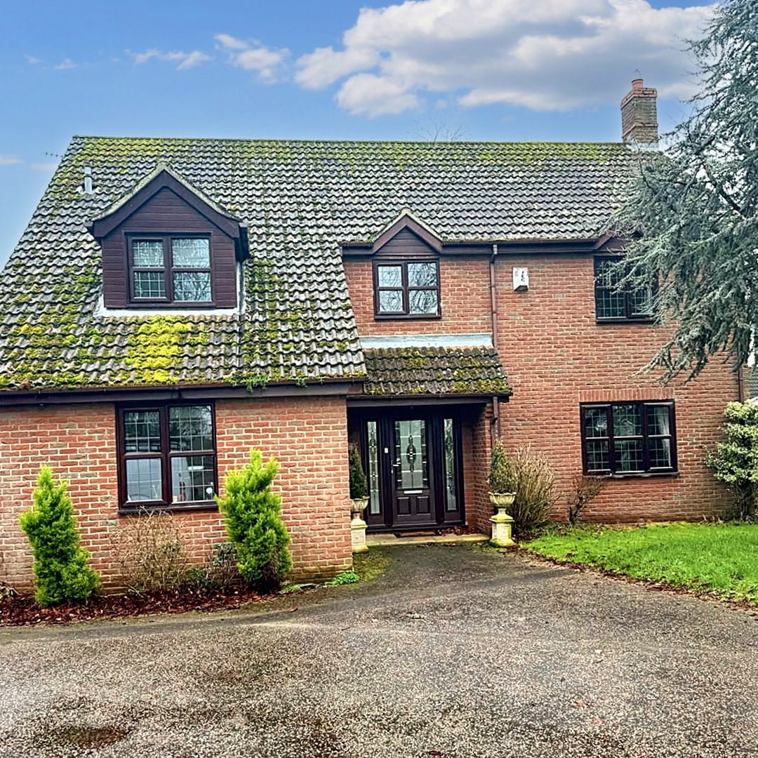 Exterior of beautiful detached home before moss removal and roof cleaningby Universal Eco Homes