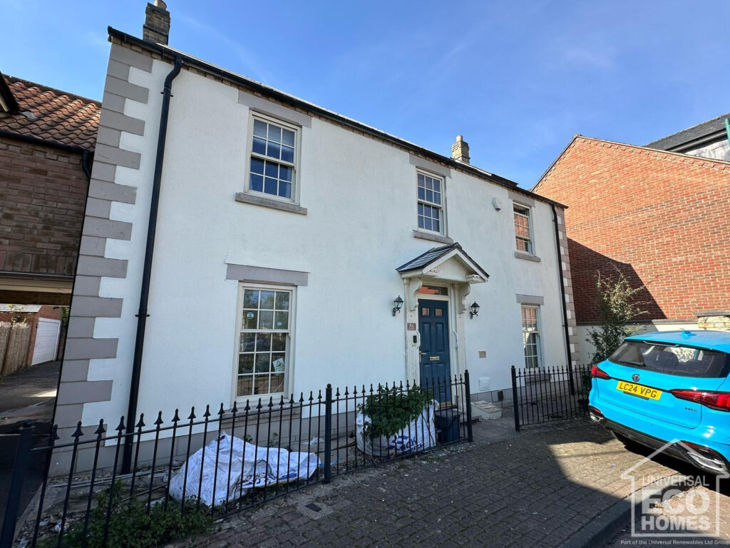 exterior of white house after wall coating companies UEH have completed wall coating