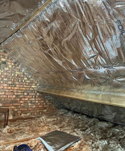 Inetrior shot of loft showing Superfoil Loft Insulation installed by Universal Eco Homes loft insulation installers